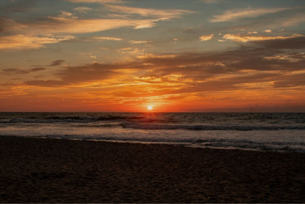 A gorgeous ocean front sunrise splashed vibrant colors across the sky. 24x36 wood